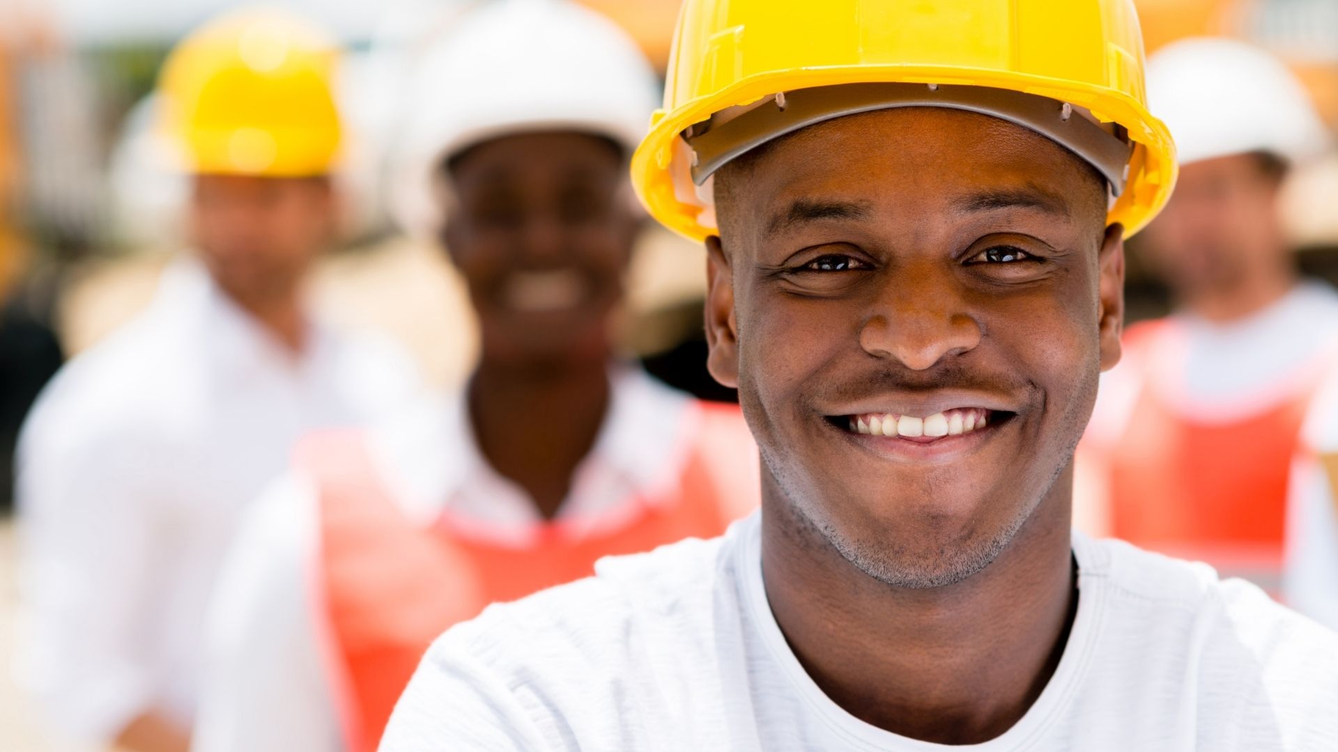 African American Construction Team smiling on the work site